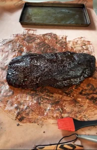 Beef Tallow poured over brisket and on butcher paper before wrapping.