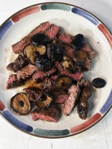 ribeye sliced with Cacao powder, chili powder and shiitake mushrooms