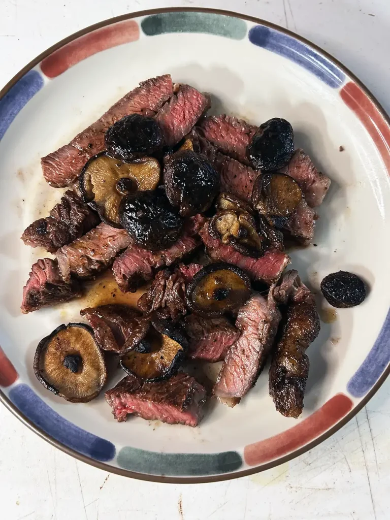 ribeye sliced with Cacao powder, chili powder and shiitake mushrooms
