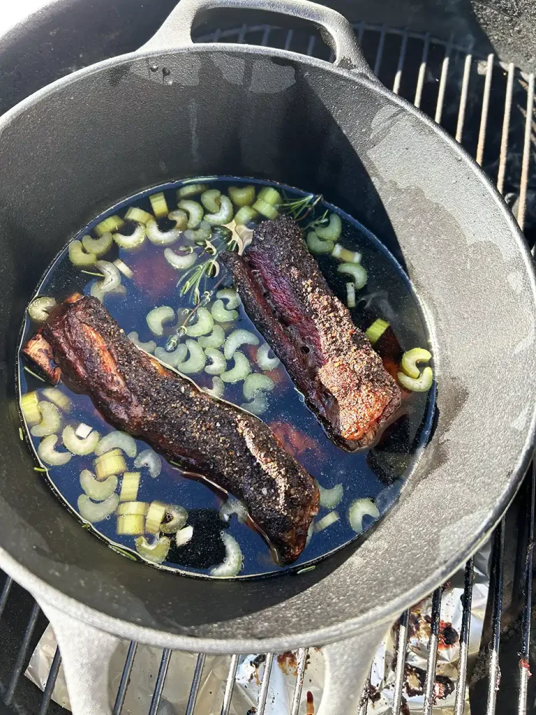 Beef Ribs in a Dutch Oven on the Weber Kettle.